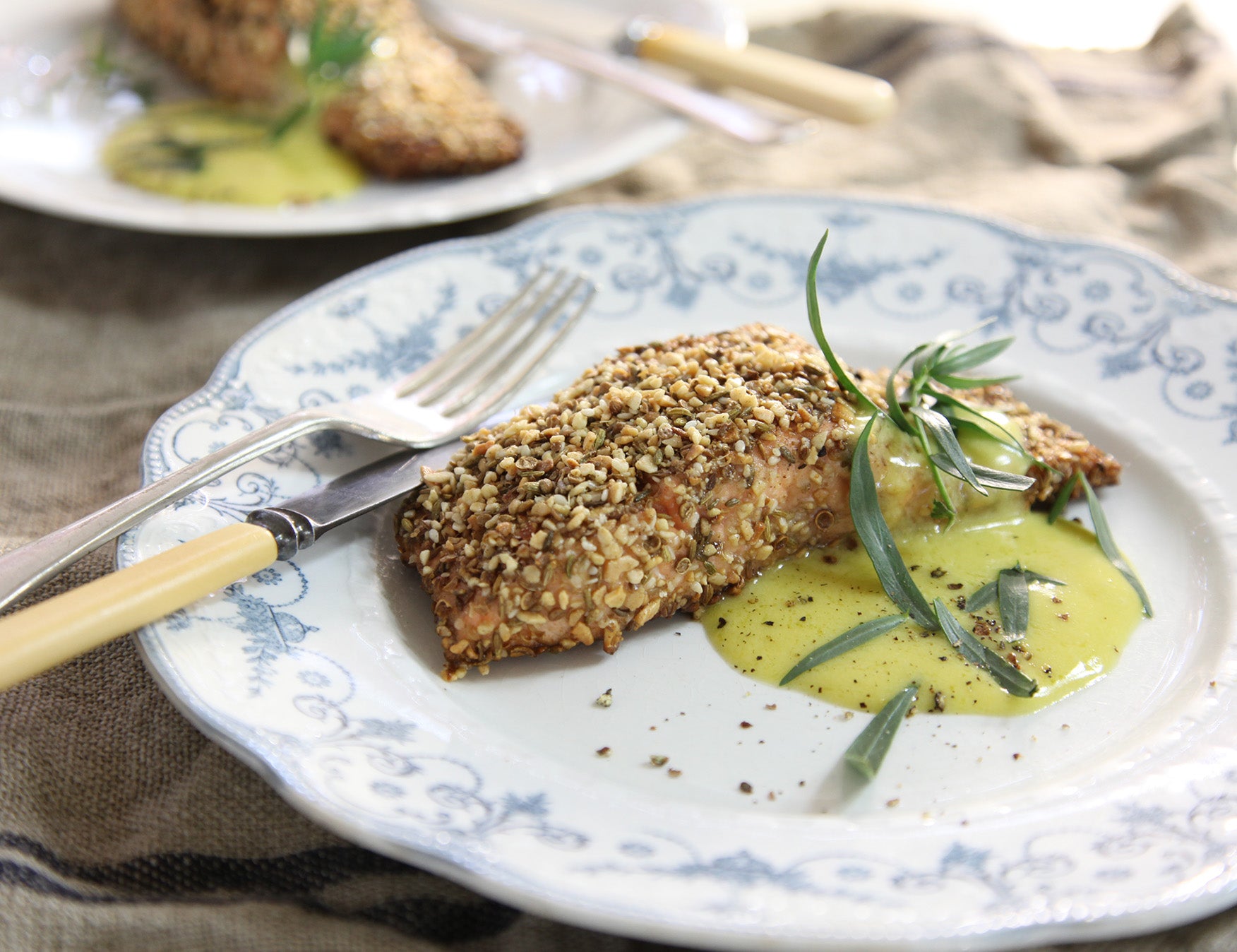 Baked salmon fillet with a crisp golden crumb crust and fresh herbs